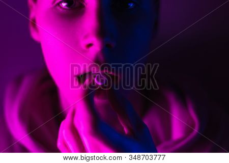 Young Teenager In A Pink Hoodie Takes A Drug In Pills. Tongue Guy With Lsd Wheel. Dilated Pupils Fro