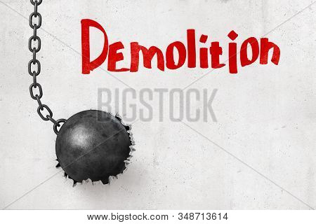 3d Rendering Of Wrecking Ball That Has Broken Hole In Concrete Wall With Title Demolition.