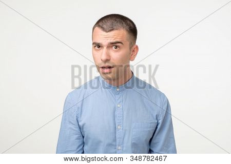 Doubtful Hispanic Man Looking With Disbelief Expression.