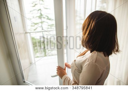 Beautiful Girl New Settler Opening Balcony Window And Enjoying Beautiful View.