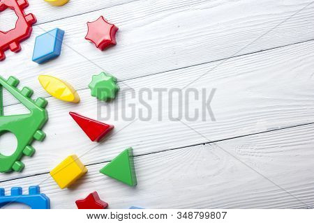 Kids Educational Developing Toys Frame On White Background. Top View. Flat Lay. Copy Space For Text