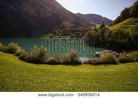 Lake Lungern Switzerland - Famous Fishing Lake In Switzerland. Reflection In Water