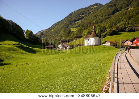 Lake Lungern Switzerland - Famous Fishing Lake In Switzerland. View Of Church And Mountains.