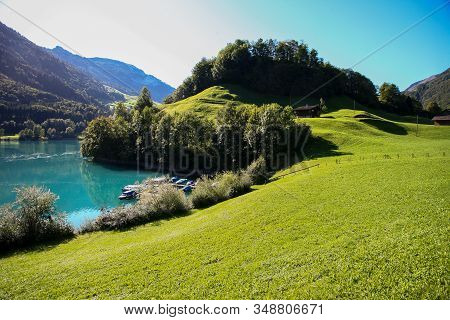 Lake Lungern Switzerland - Famous Fishing Lake In Switzerland. Reflection In Water