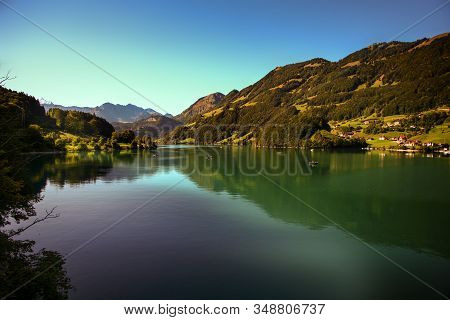 Lake Lungern Switzerland - Famous Fishing Lake In Switzerland. Reflection In Water