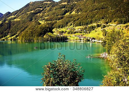 Lake Lungern Switzerland - Famous Fishing Lake In Switzerland.reflection In Water