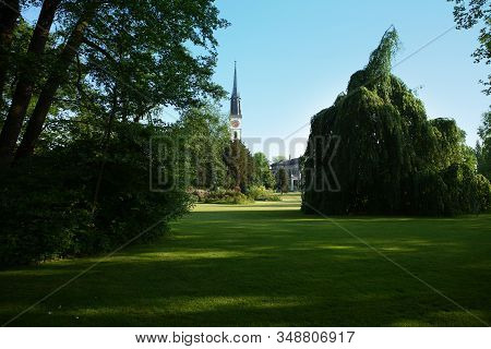 Pictures Of The City Of Zug, Switzerland. Trees, Grass And Blue Sky