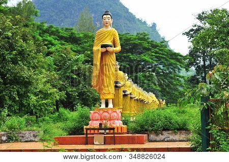 The Buddha Statue Is Located In The Outdoor. A Lot Of Buddha Image Statue At Tai Ta Ya Monastery Tem
