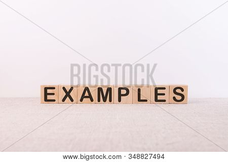 Examples Concept Written On Blocks On A Light Background