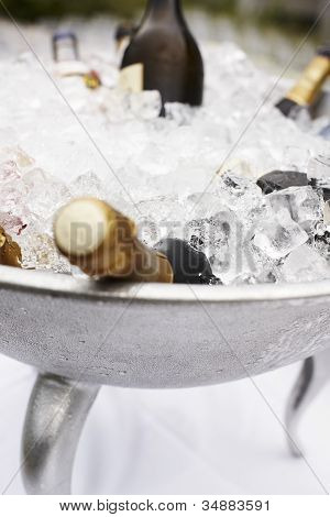 Bottles Of Champagne Cooling On Ice