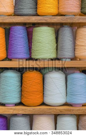 Set Of Colored Threads For Sewing On Coils. Pile Of Big Colorful Spools Of Thread. Colored Thread Sp