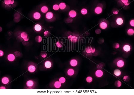 Blurredlights On A Black Background. Pink Bokeh, Festive Concept.