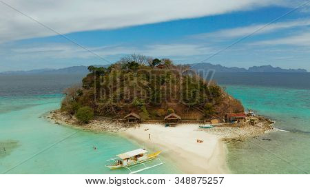 Aerial Seascape Tropical Island And Sand Beach, Turquoise Water And Coral Reef. Malacory Island, Phi