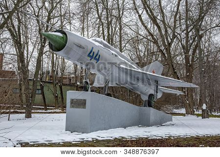Mig-21 Fighter On A Street Stone Pedestal
