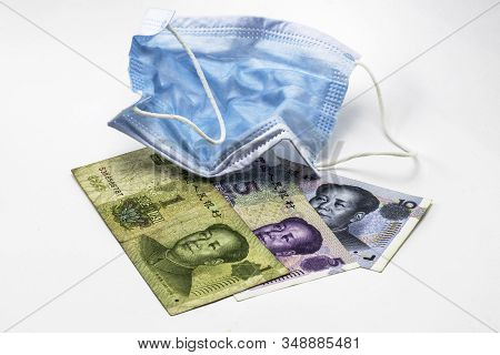 The Concept Coronovirus And Economy Of China Chinese Yuan Money Lie Near Medical Hygiene Mask