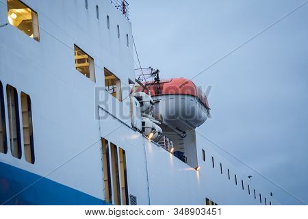 Big White Cargo Shipe Side View Details. Photo Taken In Cloudy Overcast Day In Port, Europe.