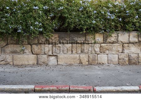 Red And White Colored Road Curbstone Indicating The Prohibition Of Parking On Israel Street