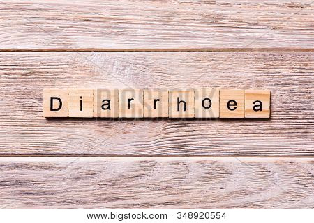 Diarrhoea Word Written On Wood Block. Diarrhoea Text On Wooden Table For Your Desing, Coronavirus Co