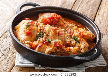 Andorra Recipe Stew Of Rabbit In Tomato Sauce With White Wine And Herbs Close-up In A Pan. Horizonta