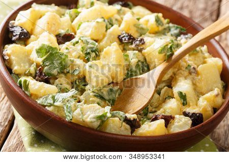 Morocco Cuisine Potato Salad With Yogurt, Herbs, Spices And Dried Olives Close-up In A Bowl. Horizon