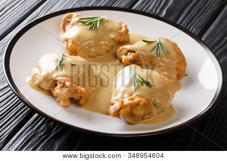 Portion Of Chicken Thighs Baked With Dijon Mustard And Maple Syrup Close-up In A Plate. Horizontal