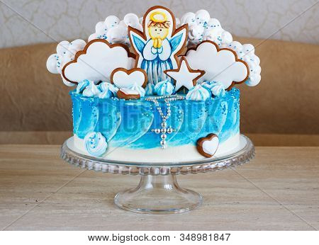 Blue Baptism Cake With An Angel On A Gingerbread