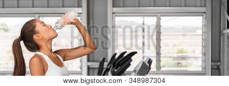 Gym fitness woman drinking water bottle dehydrated during run workout banner panorama crop. Healthy Happy girl training on running treadmill machine.