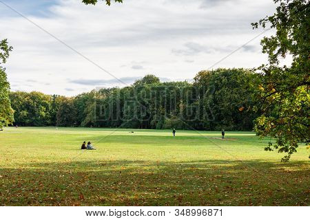 Berlin, Germany- October 6, 2019: Big Beautiful Meadow In The Treptower Park, People Relax In Nature