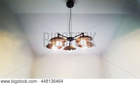 Retro-like Black Cailing Lamp Hanging From The Cailing With White Background