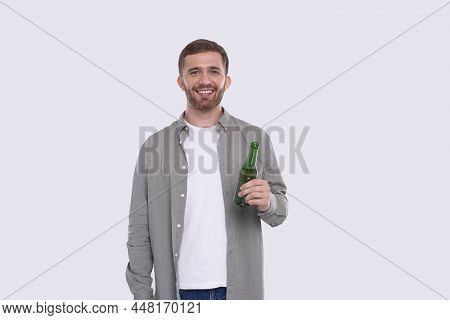 Man Holding Beer Bottle. Man With Beer Bottle In Hands. Alcohol Drink Bottle. Drink