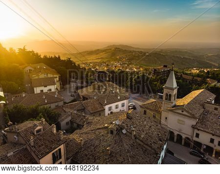 Sunset Aerial View Of San Marino Microstate And Emilia-romagna Region Of Italy From The Rooftops Of