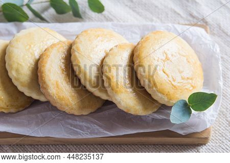 Homemade Russian Milk Cookies Korzhiki On White Paper, Selective Focuc.