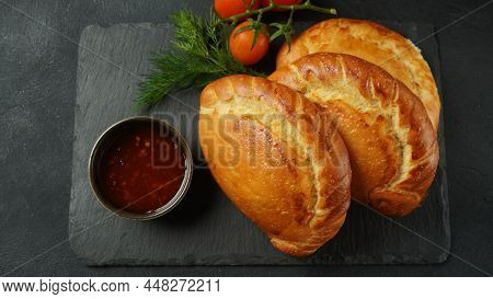 Latin American Fried Empanadas With Tomato Sauce. Argentinian Empanada Is A Pastry Turnover Filled W