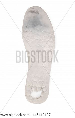 Old And Shabby Orthopedic Insoles Isolated On White Background. Dirty Leather Insoles. Worn Out Thin