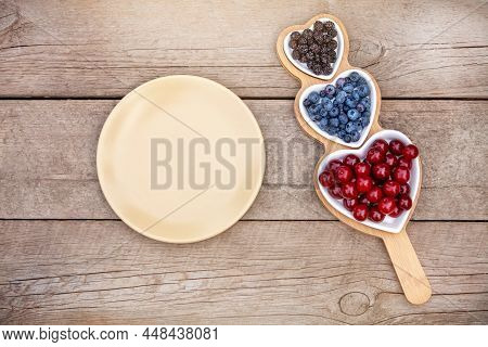 Portion Wooden Dish On Light Wooden Background Top View. Wooden Partitioned Dish Divided Into Equal 
