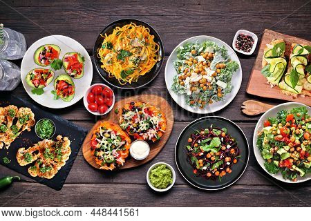 Healthy Plant Based, Low Carb Diet Table Scene. Above View On A Dark Wood Background. Vegetable Nood