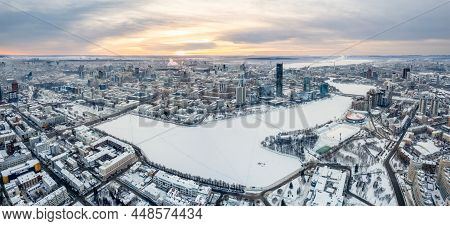 Yekaterinburg Aerial Panoramic View In Winter At Sunset. Yekaterinburg City And Pond In Winter. Yeka