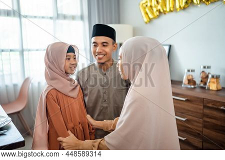 Muslim Parent Having Conversation With Their Little Girl