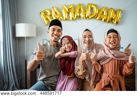 Beautiful Muslim Family Portrait Together Smiling To Camera