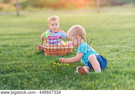 Toddler Eggs Hunters Close-up. Children Activity For Easter In Nature.