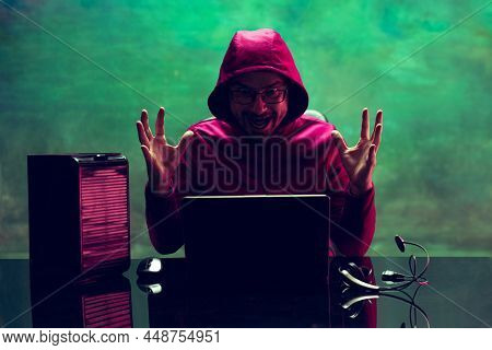 Portrait Of Man, Computer Geek, Hacker Working With Laptop, Breaking Security System Isolated Over D