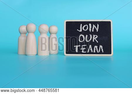 Recruitment And Hiring Concept. Wooden Dolls And Mini Blackboard With Text Join Our Team On Blue Bac