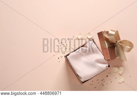 Open Gift Box, Confetti And Rose Petals On Pink Background, Flat Lay. Space For Text