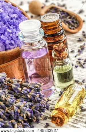 Lavender's Spa Products With Dried Lavender Flowers On A Wooden Table. Flat Lay Bath Salt And Massag