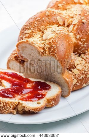 Czech Christmas pie called vanocka with strawberry marmelade