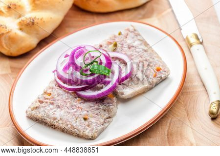 salty jelly called sulc with red and spring onion