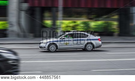 Russian Police Vehicle Speeds On The Street On High Speed. Moscow, Russia - July 2021