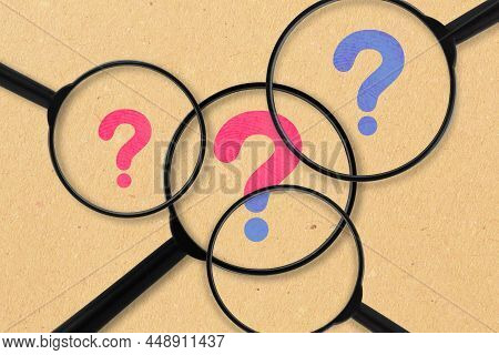 Magnifying Glasses With Pink And Blue Question Mark - Concept Of Detecting Gender Identity