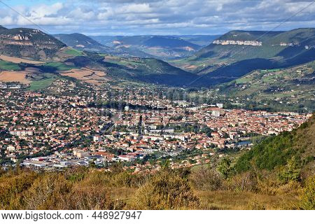 Millau Town View With Causse Du Larzac Limestone Plateau In France. One Of Grands Causses, Plateaus 