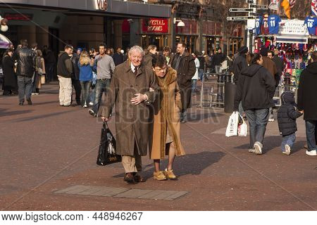 London, England - 17 April 2017, Elderly Couple, Husband And Wife Walking Along Piccadilly Circus